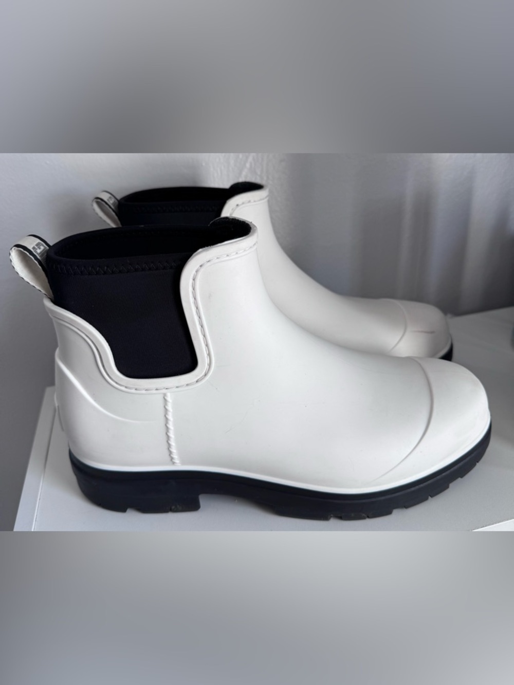 UGG White and Black Slip-On Waterproof Sneakers